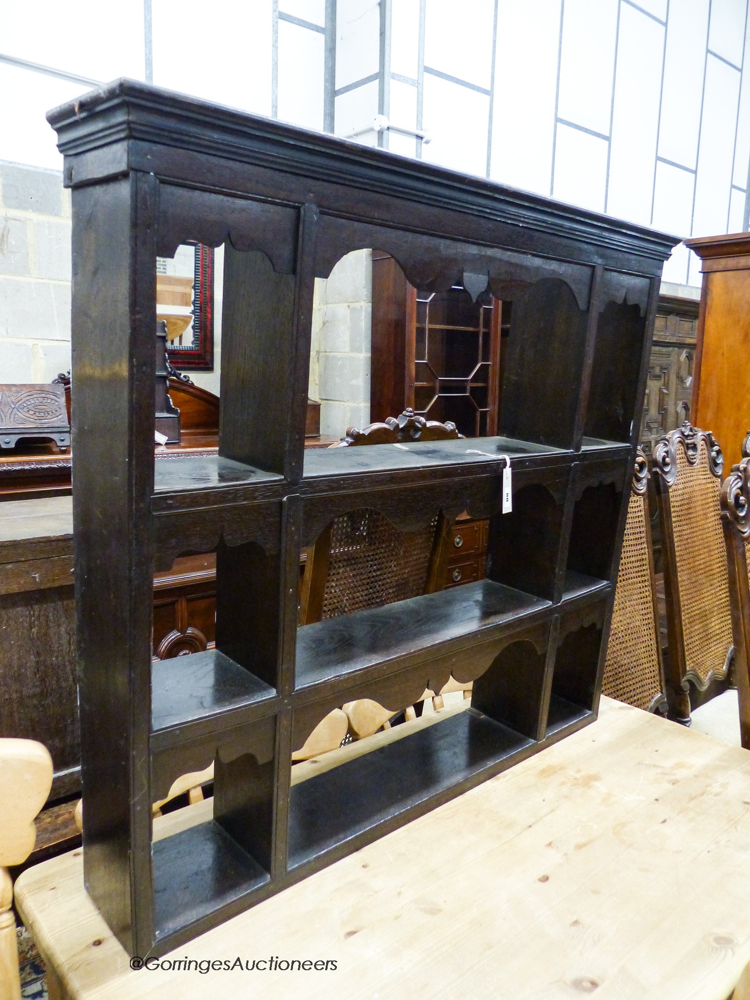 An 18th / 19th century oak three-shelf hanging plate rack, width 107cm, depth 18cm, height 98cm